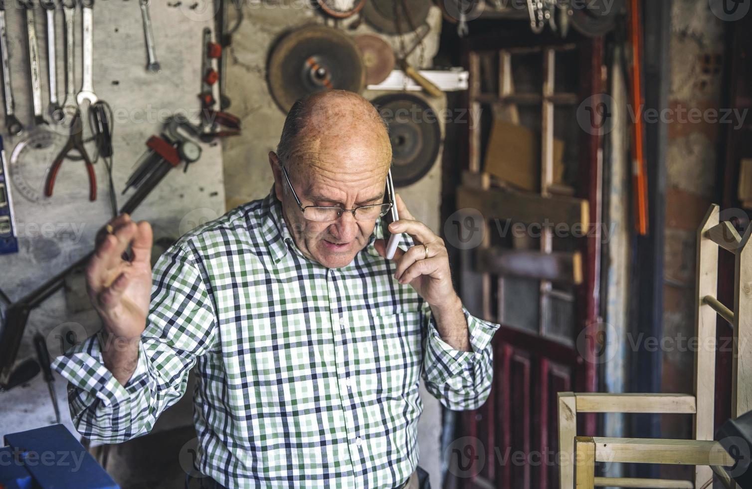 Carpenter in his workshop photo