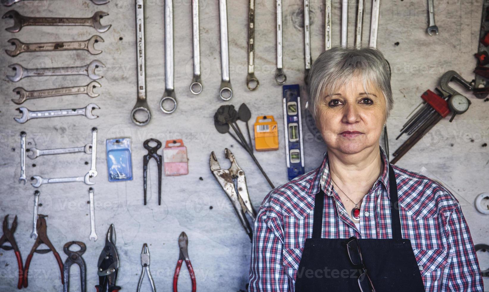 Female carpenter in his workshop photo