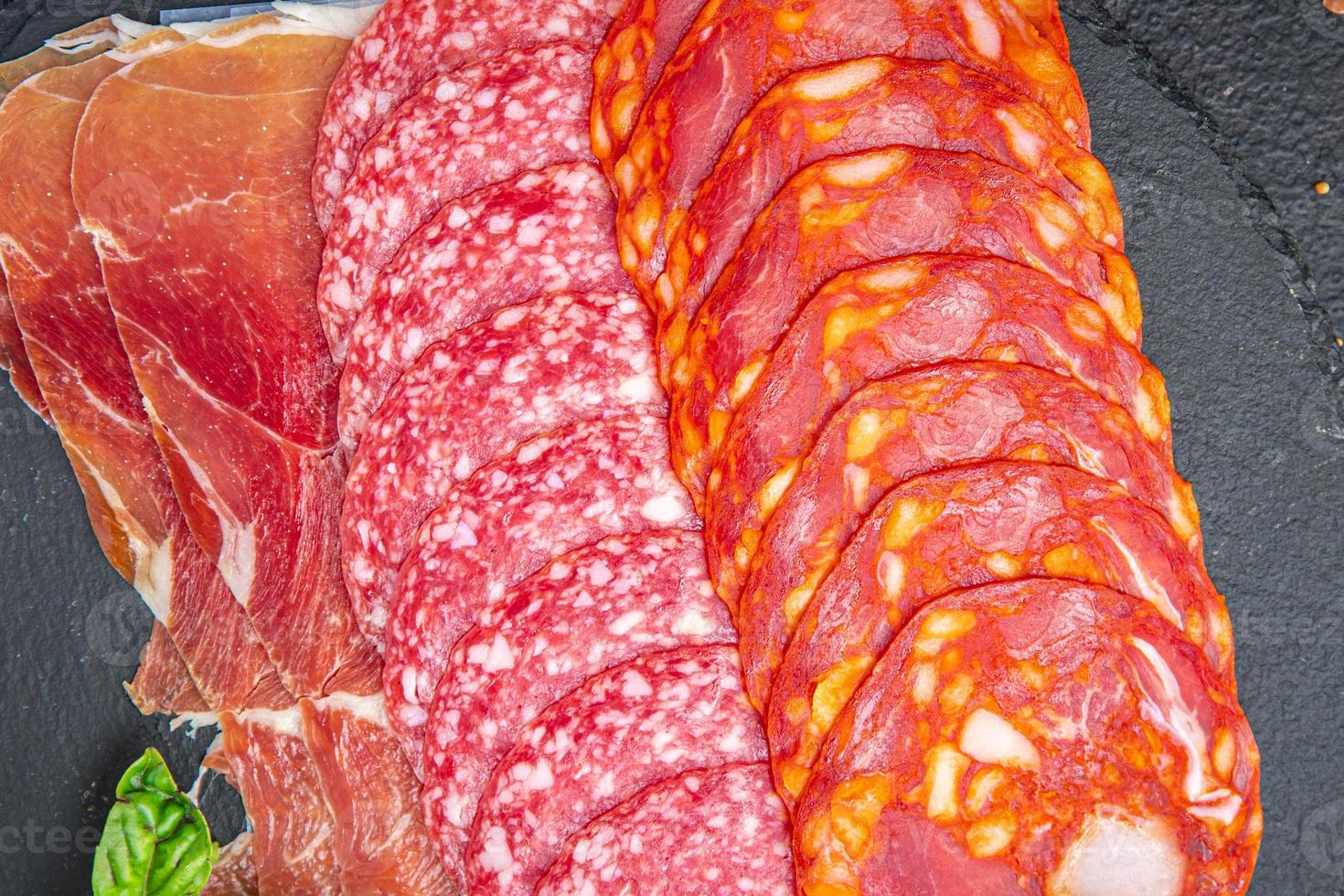 sausage meat assorted slice slicing salami, chorizo, jamon prosciutto photo