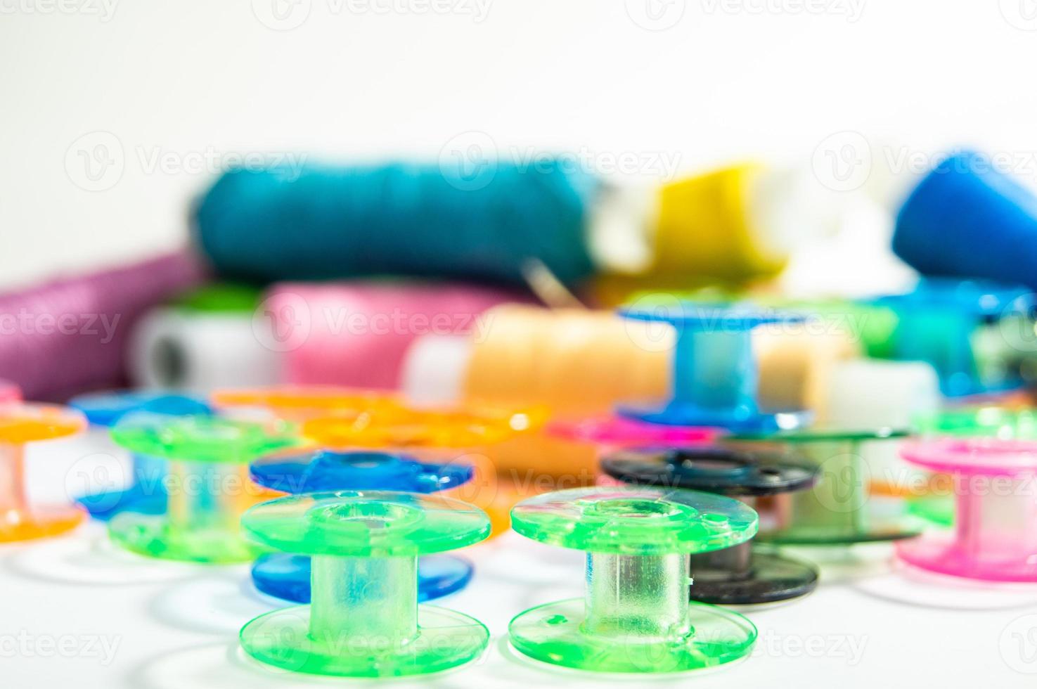 Bobbins with thread photo