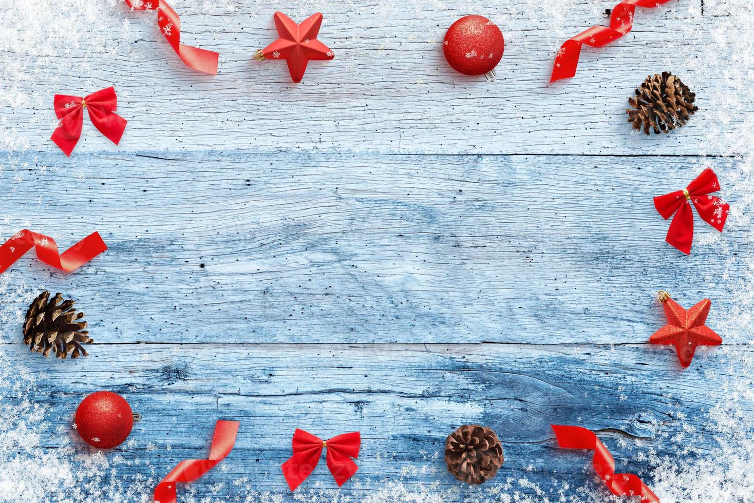 Christmas background with decorations on blue wooden table. Top view, flat lay composition photo