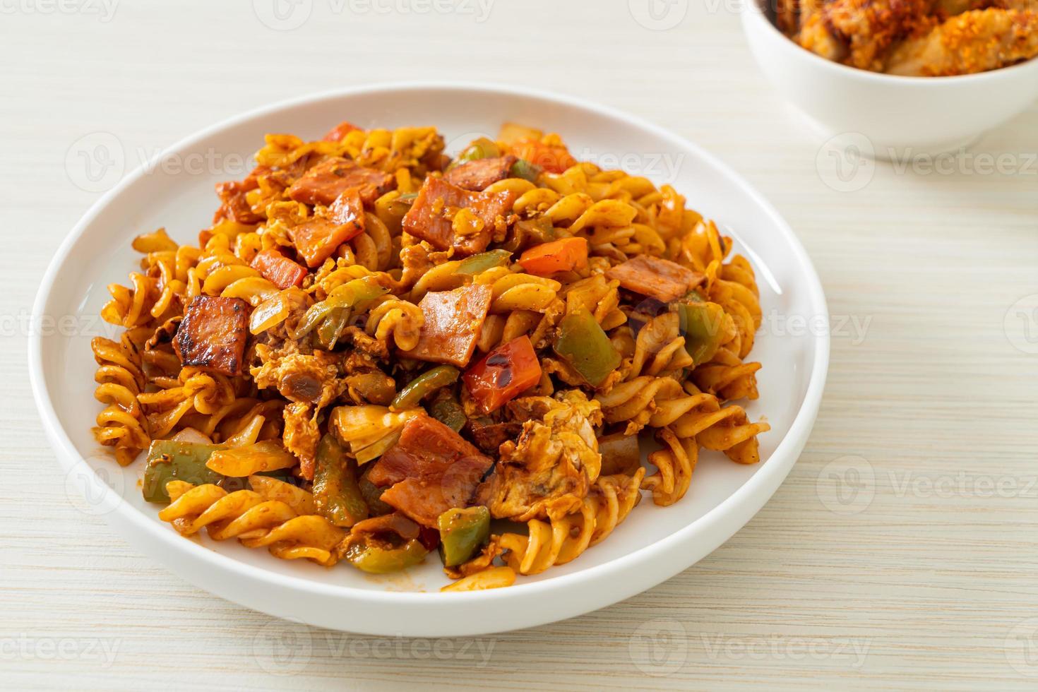 fusilli pasta with ham and tomatoes sauce photo