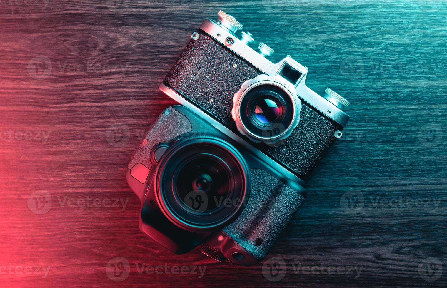 Old and new camera. Concept of technology progress. Blue and red light photo