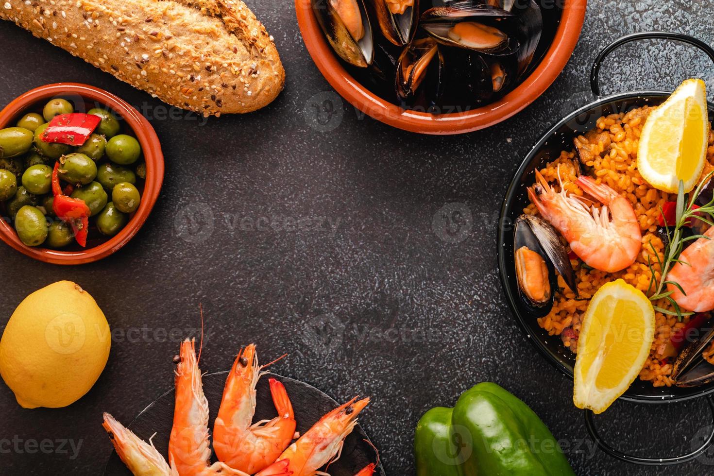 Vegetable paella with seafood, top view and copy space photo