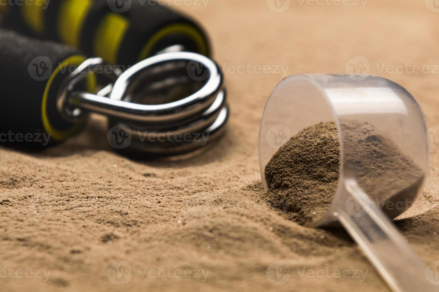 Scoops filled with protein powders for fitness nutrition to start training photo