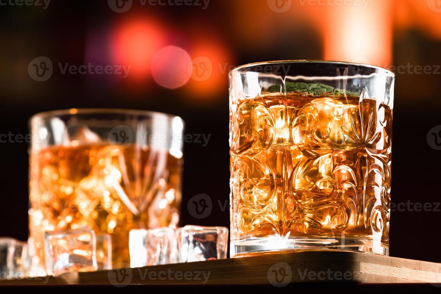 Whiskey Drinks with ice in a lounge bar photo