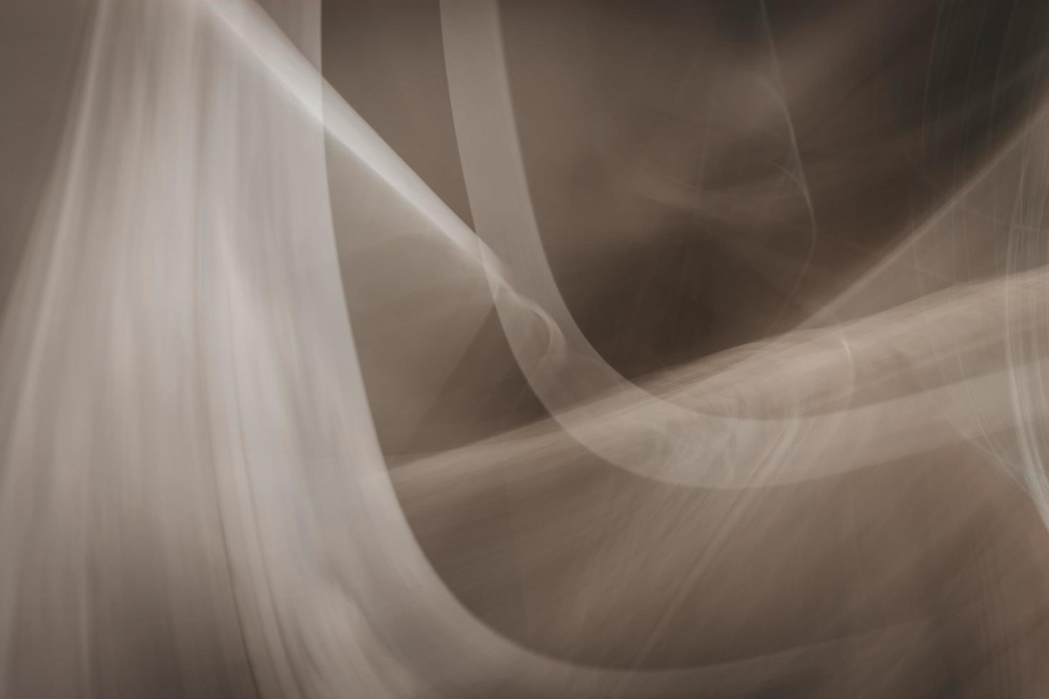 Abstract background in brown tones. Curved lines, gradients and highlights. photo