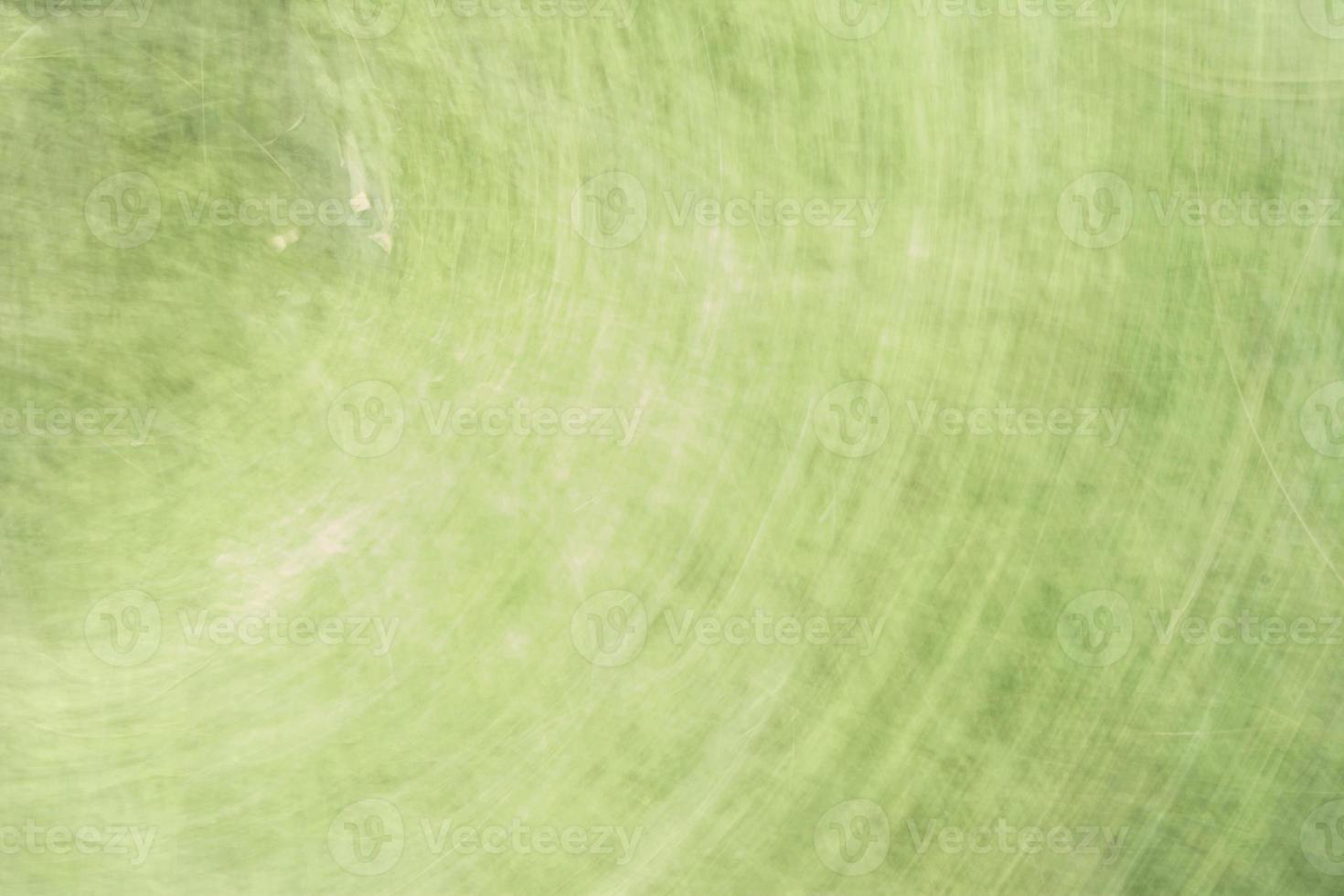 Fondo verde pálido abstracto con reflejos circulares. foto