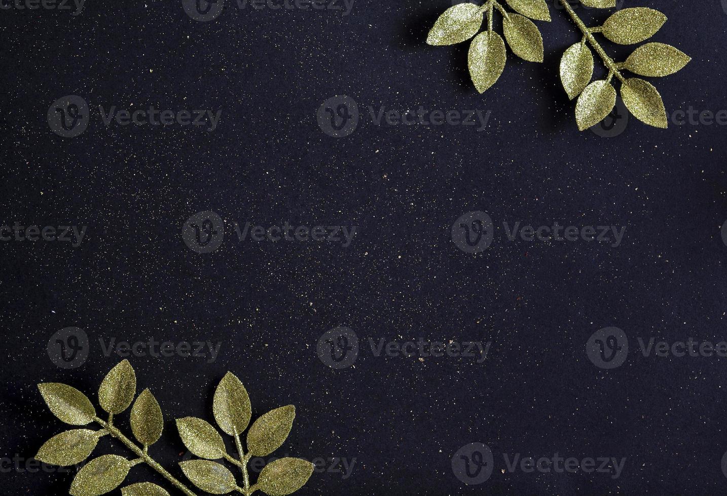 Flat lay Christmas floral with New Year tree branches and glitter on black background photo