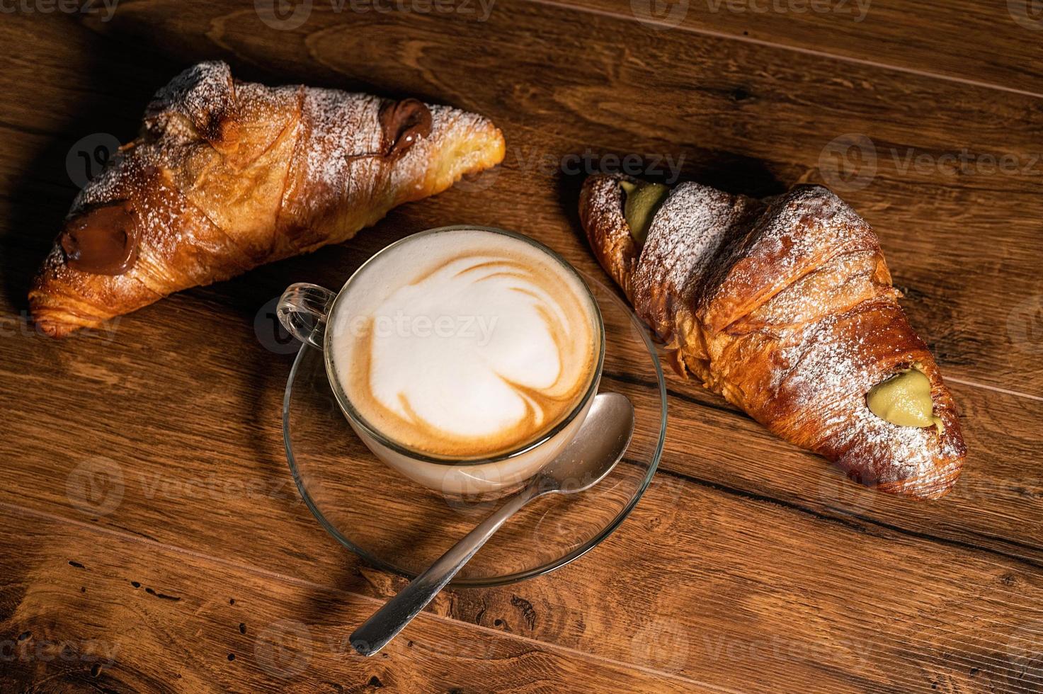 sweet croissants with cream and cappuccino photo