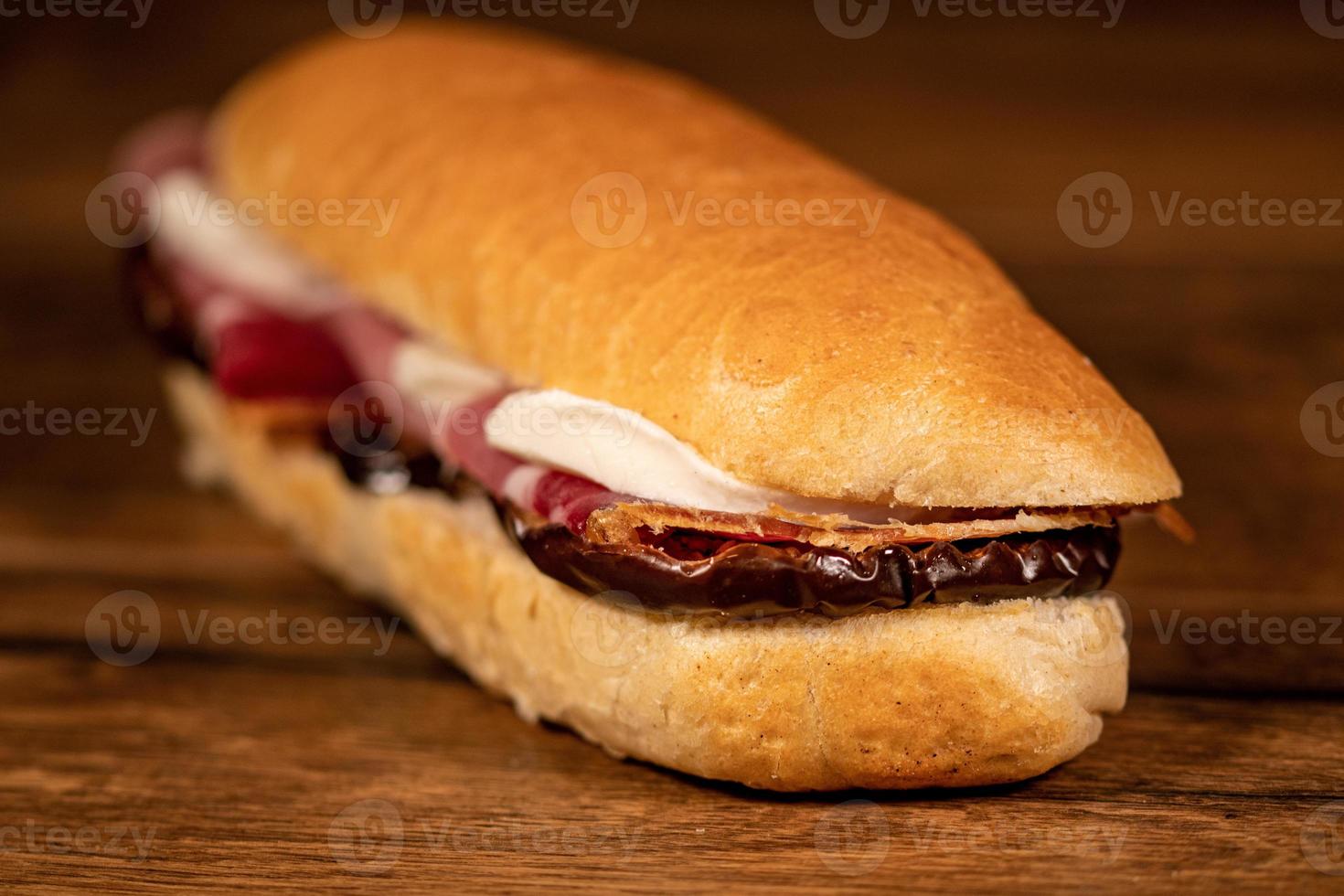 sandwich with salami and vegetables photo