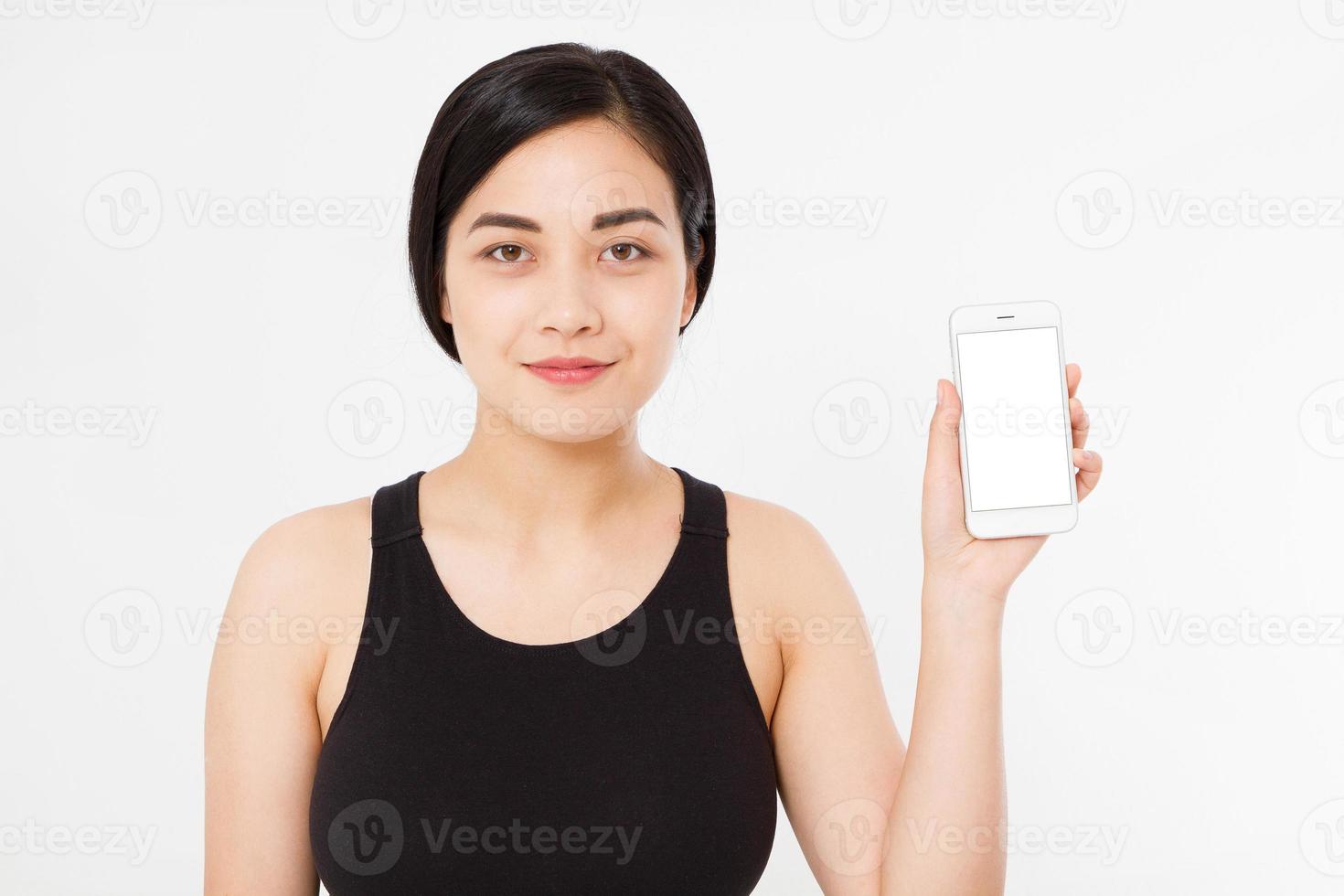 Smiling asian japanese woman hold white smartphone or cellphone isolated on white background texture.advertising concept. Positive face expression human emotion. Copy space. photo