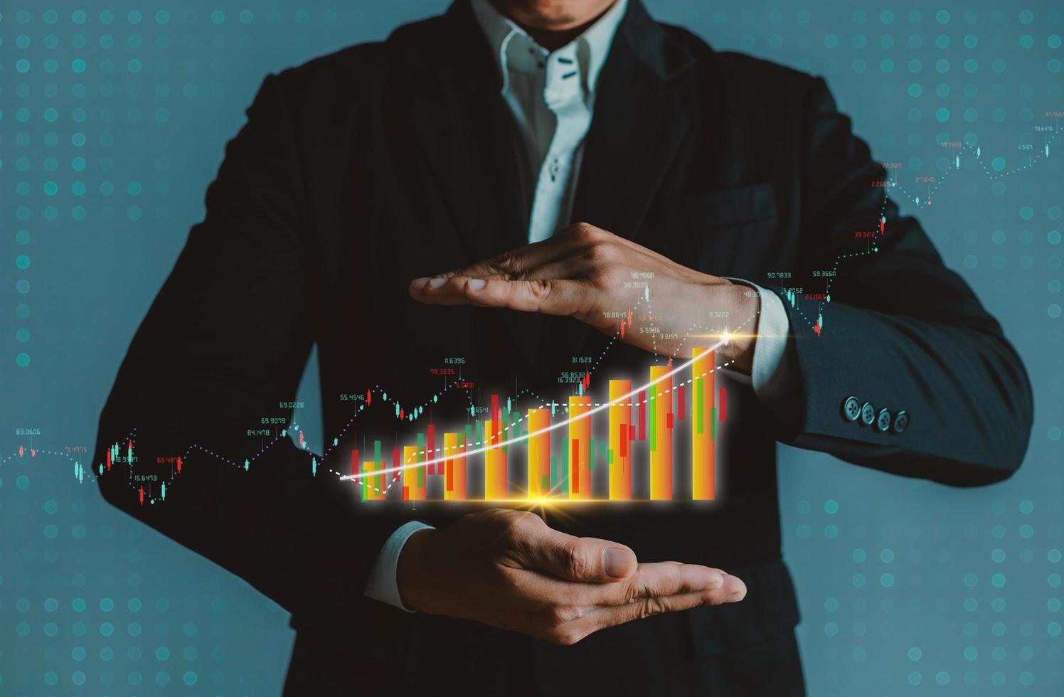 Businessman showing a growing corporate income statistics graph. photo