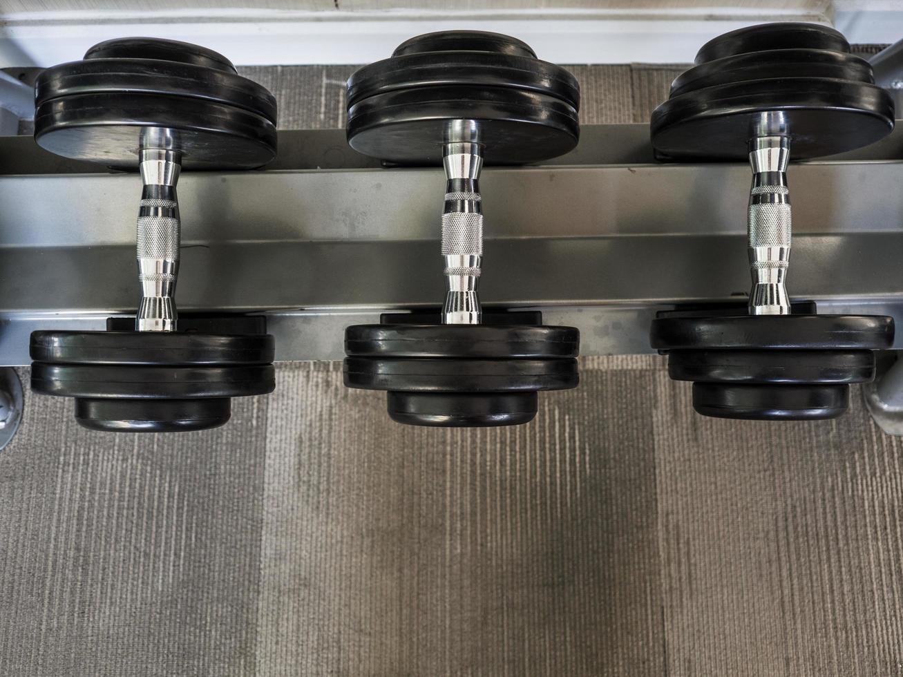 Dumbbell set left on the racks. photo