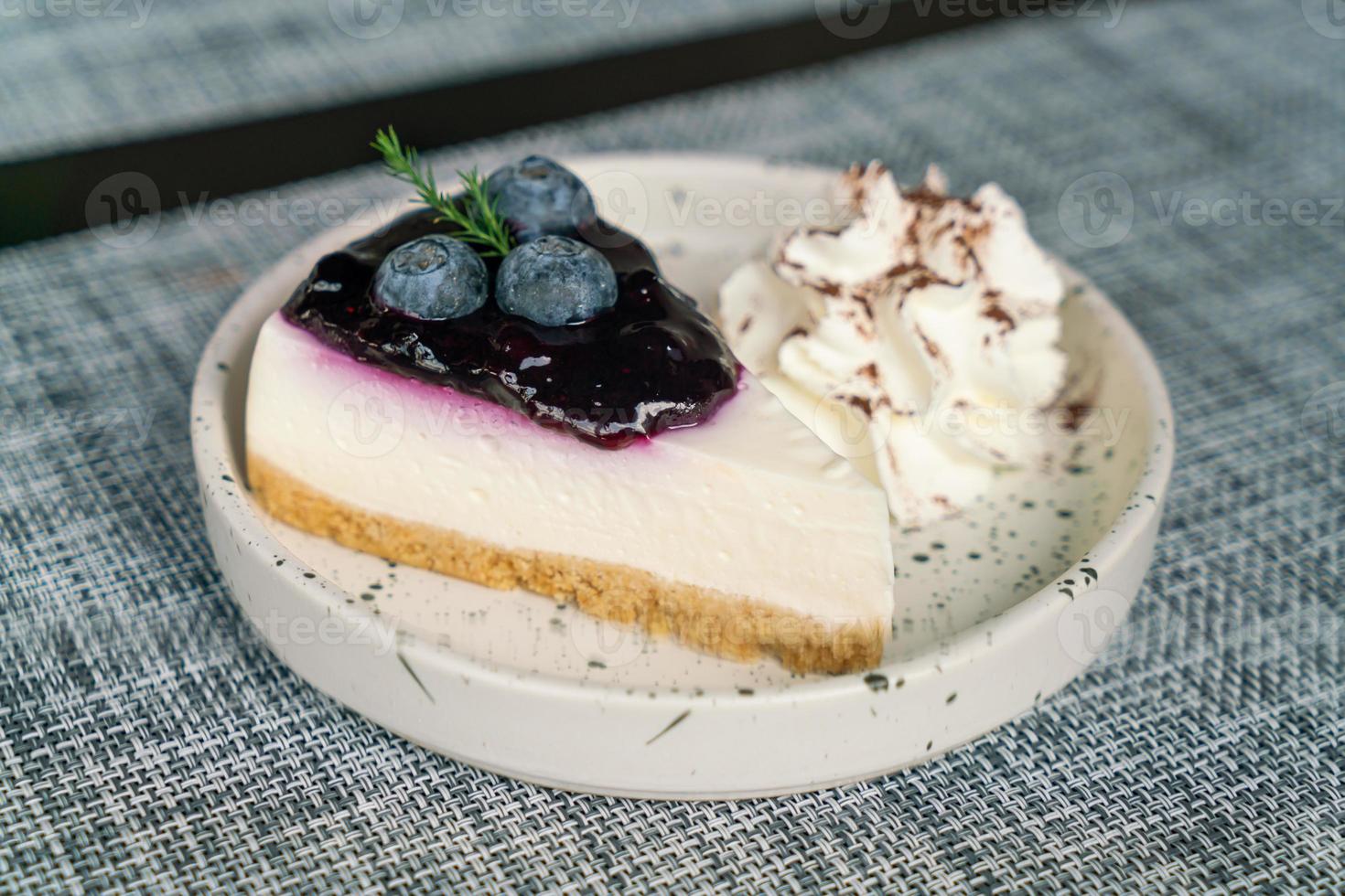 blueberry cheese cake on plate photo