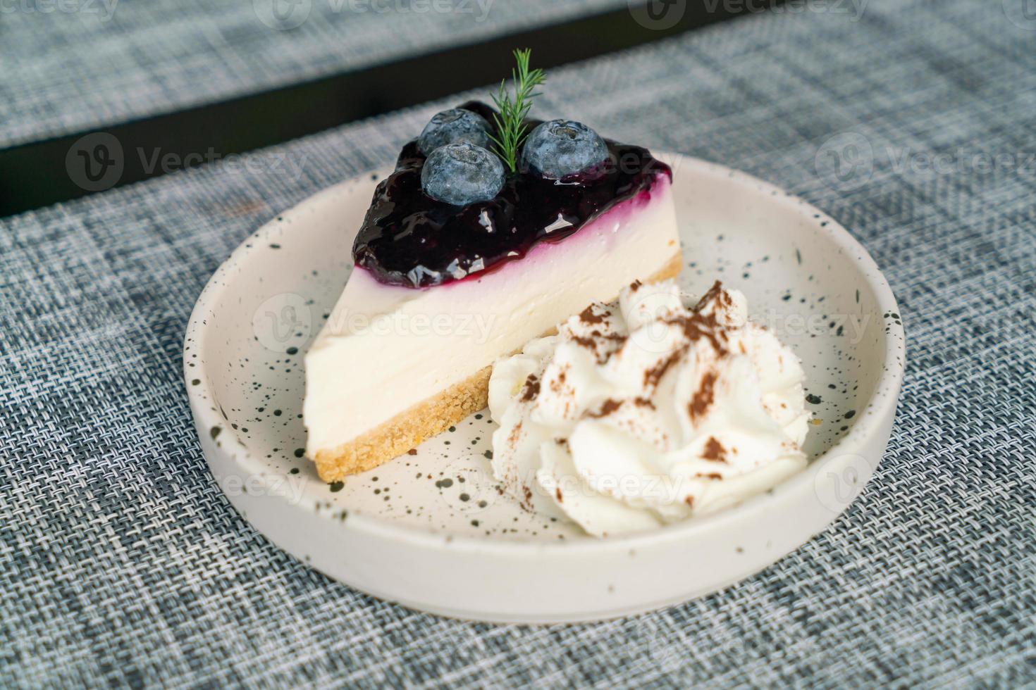 blueberry cheese cake on plate photo
