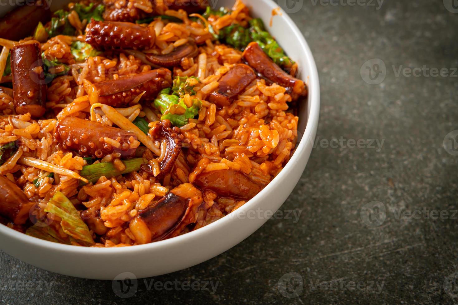 Stir-fried squid or octopus with Korean spicy sauce rice bowl photo