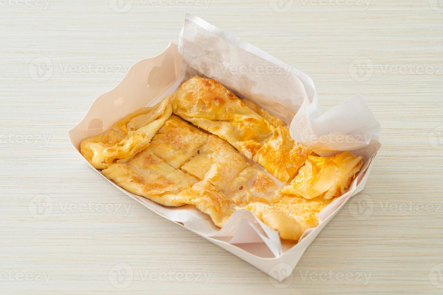 roti with egg and sweetened condensed milk photo