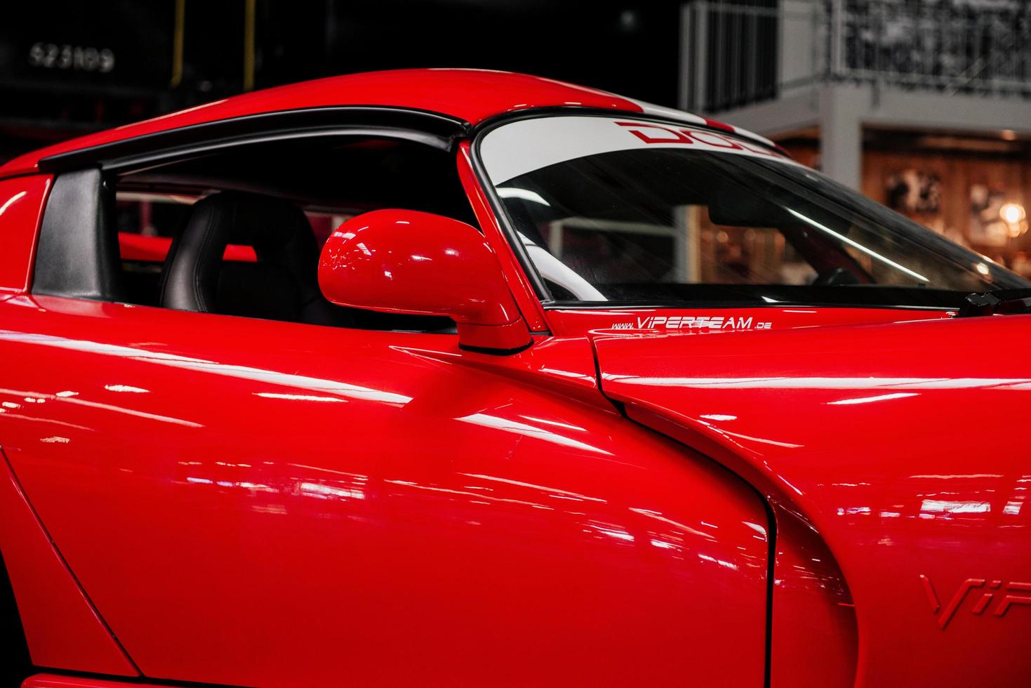 SINSHEIM, GERMANY - OCTOBER 16, 2018 Technik Museum. Sport car standing indoor. Polished red colored surface photo