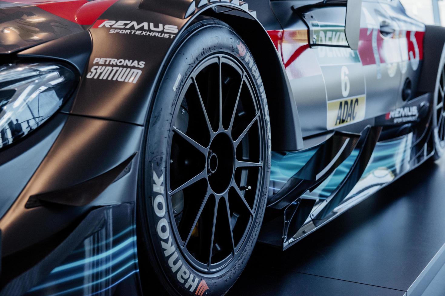 STUTTGART, GERMANY - OCTOBER 16, 2018 Mercedes Museum. Luxury vehicle. Left side of the beautiful brand new sport car parked on the black stand photo