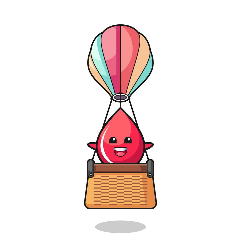 blood drop mascot riding a hot air balloon vector