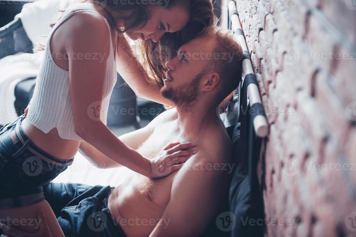 Beautiful couple in love being passionate in bed photo