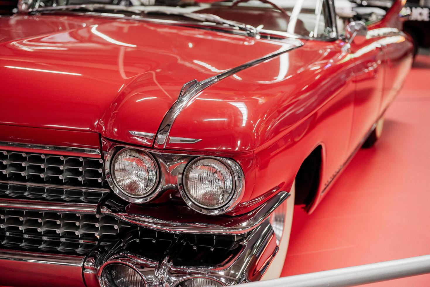 SINSHEIM, GERMANY - OCTOBER 16, 2018 Technik Museum. Front and left parts. Beautiful polished red vintage car. Cabriolet style photo