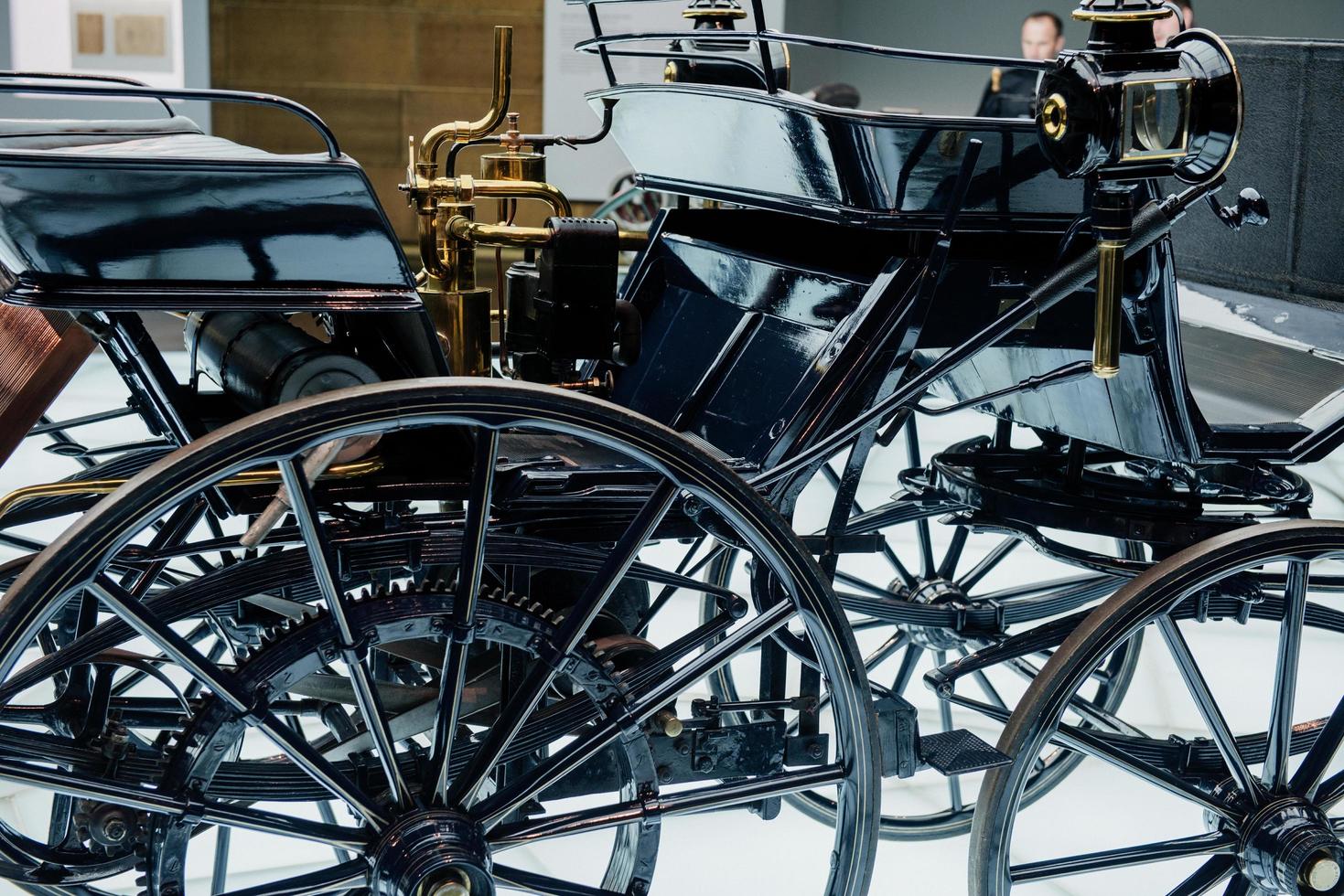STUTTGART, GERMANY - OCTOBER 16, 2018 Mercedes Museum. Black horse wagon. Old vehicle looks like new one. Person behind photo