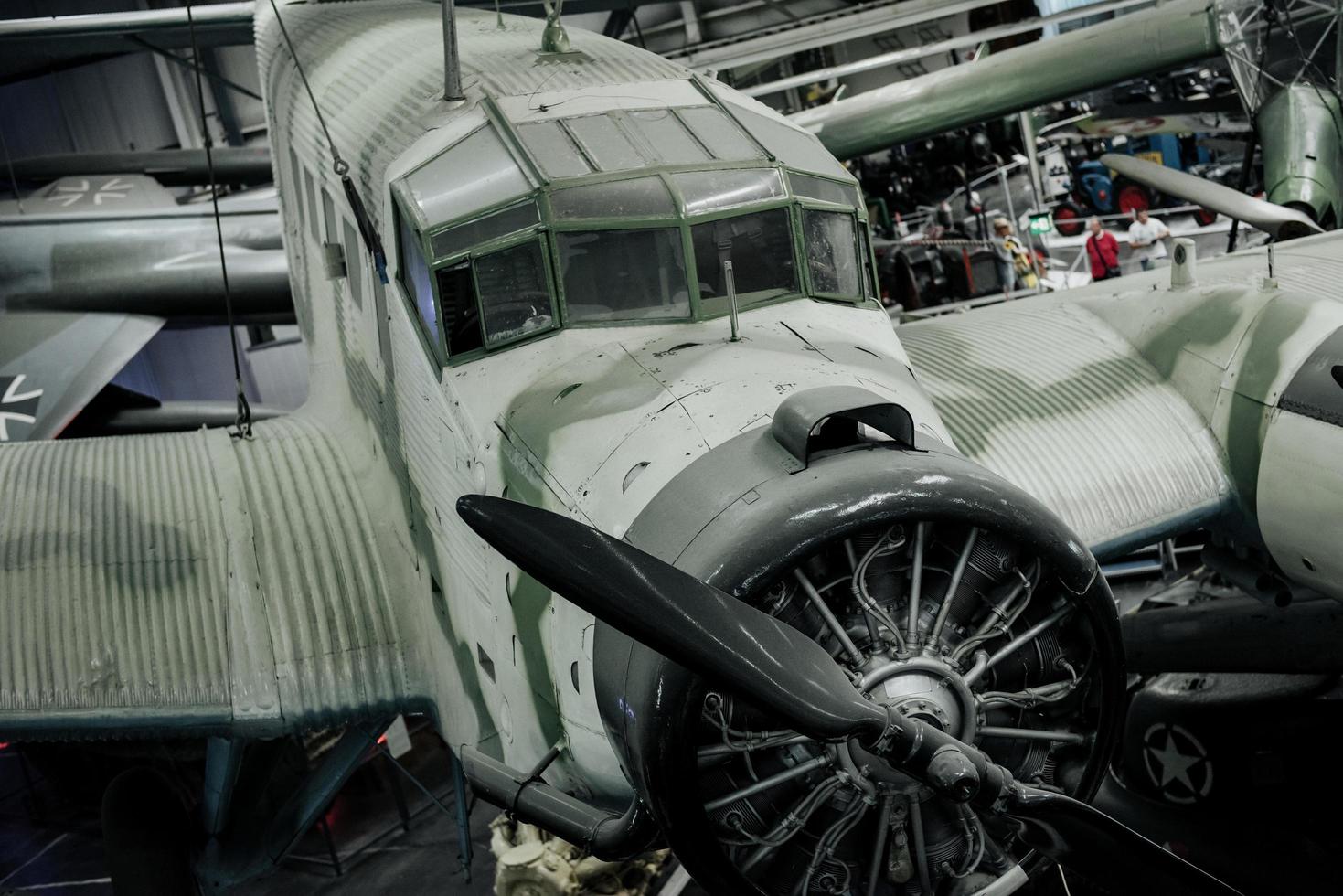 SINSHEIM, GERMANY - OCTOBER 16, 2018 Technik Museum. People at background. Historical old airplanes indoors at the exhibition photo