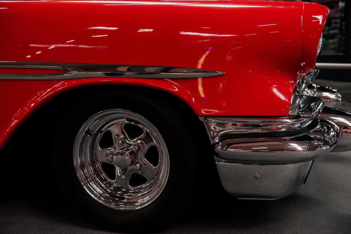 SINSHEIM, GERMANY - OCTOBER 16, 2018 Technik Museum. Lower part of shiny red vintage car photo