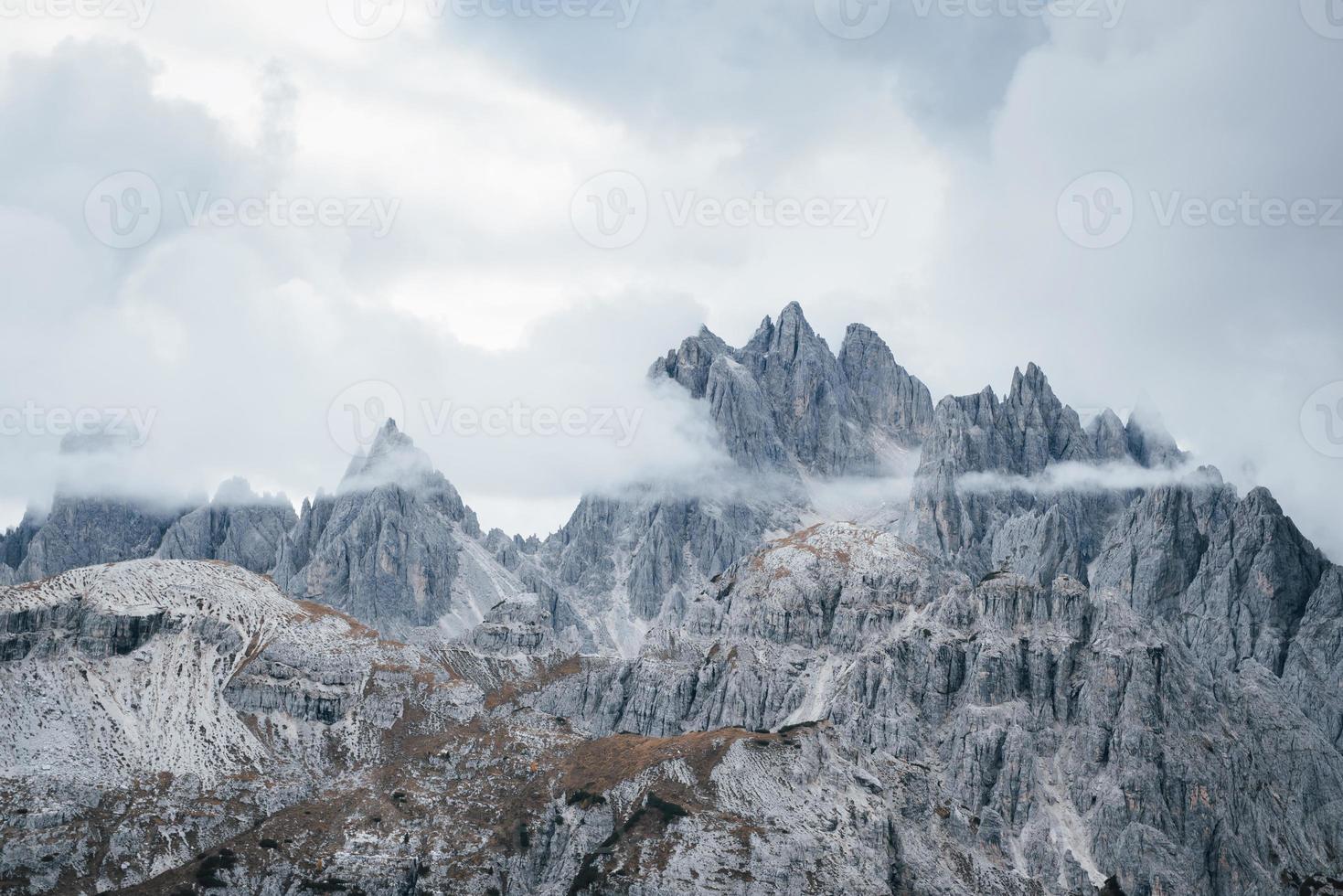 Landscape of montains surrounded by fog and clouds photo