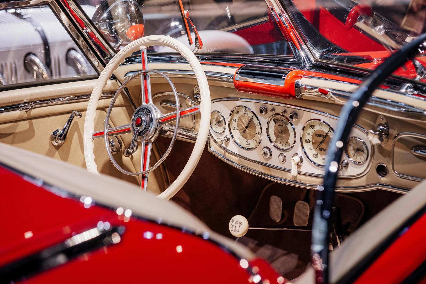 Shiny look. Car dashboard, steering wheel, and front glasses captured from the back photo