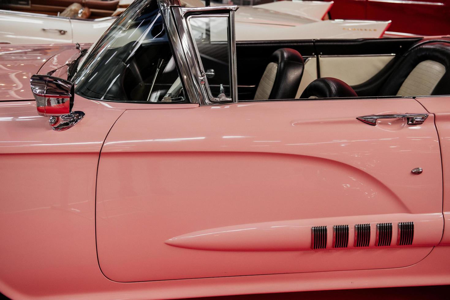 SINSHEIM, GERMANY - OCTOBER 16, 2018 Technik Museum. Side view of the rare pink cabriolet. Beautiful classic photo