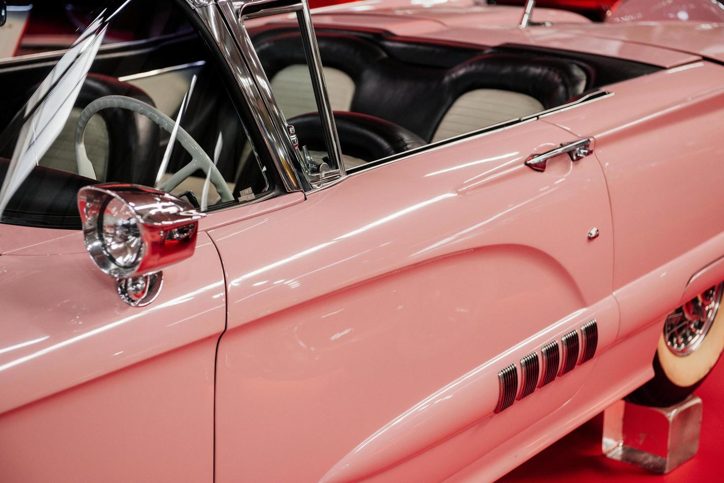 SINSHEIM, GERMANY - OCTOBER 16, 2018 Technik Museum. Historical car. Side view of the rare pink cabriolet. Beautiful classic photo
