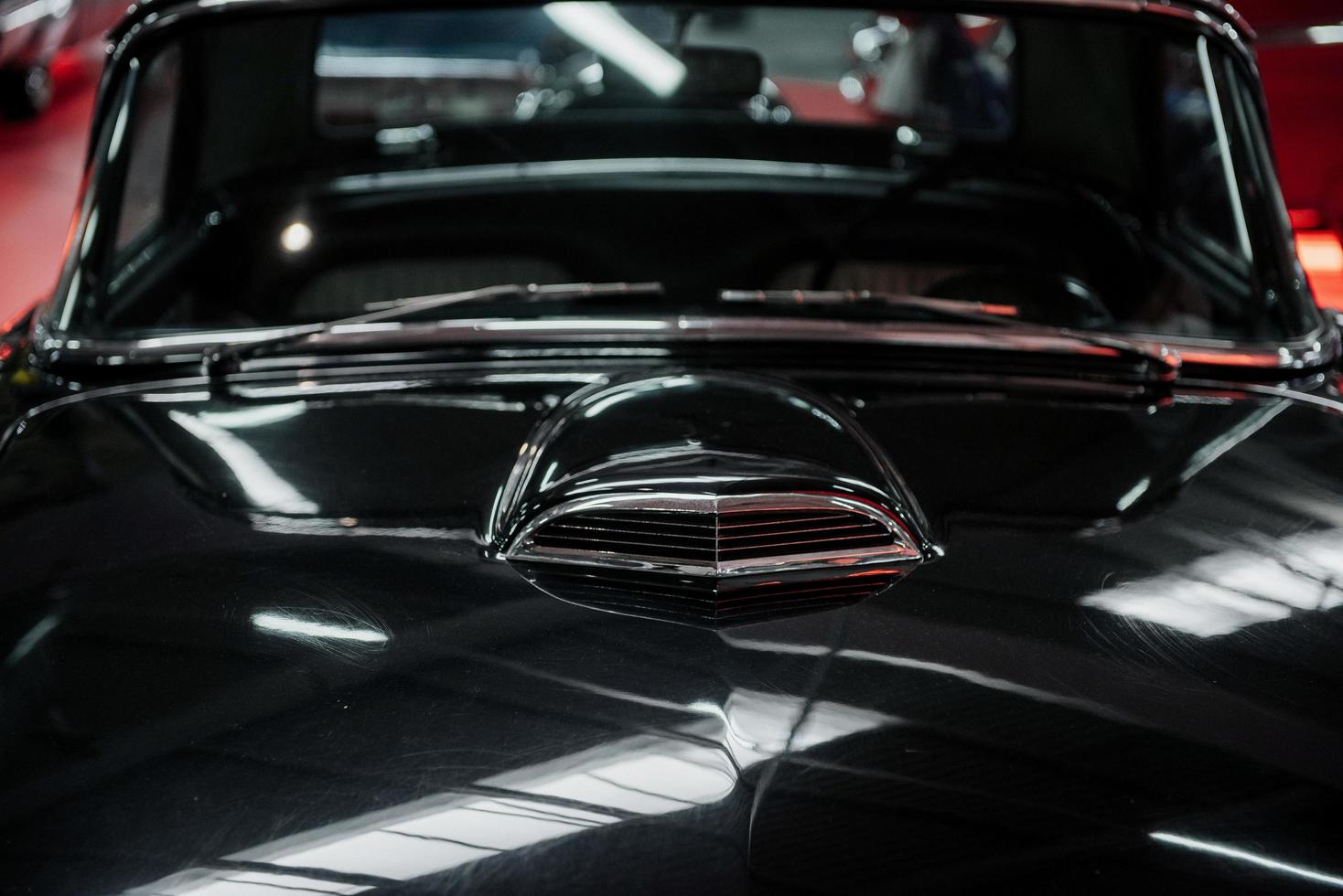 SINSHEIM, GERMANY - OCTOBER 16, 2018 Technik Museum. Hood and front glass. Classic black luxury historical car in great condition photo