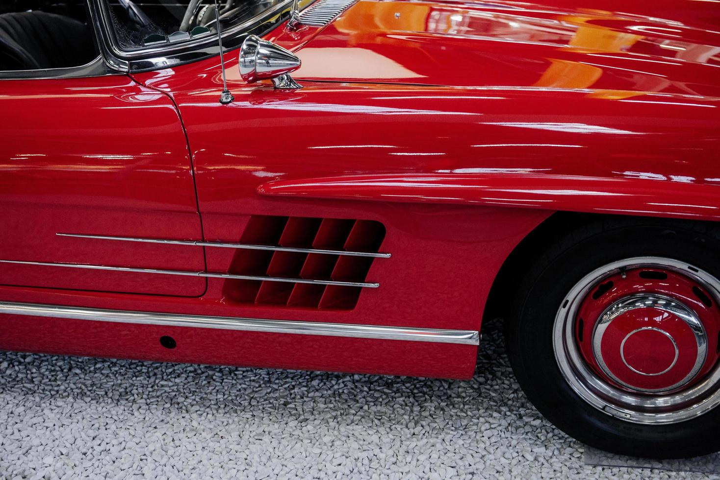 SINSHEIM, GERMANY - OCTOBER 16, 2018 Technik Museum. Awesome condition. Front side of the red car that stands on the rock surface photo