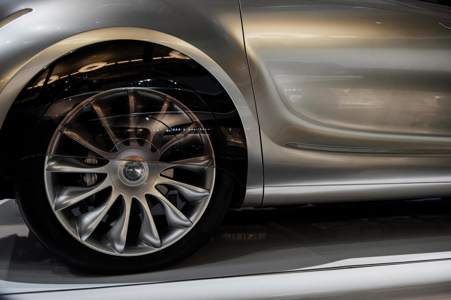 STUTTGART, GERMANY - OCTOBER 16, 2018 Mercedes Museum. Left front wheel of the silver shiny perfectly polished car photo