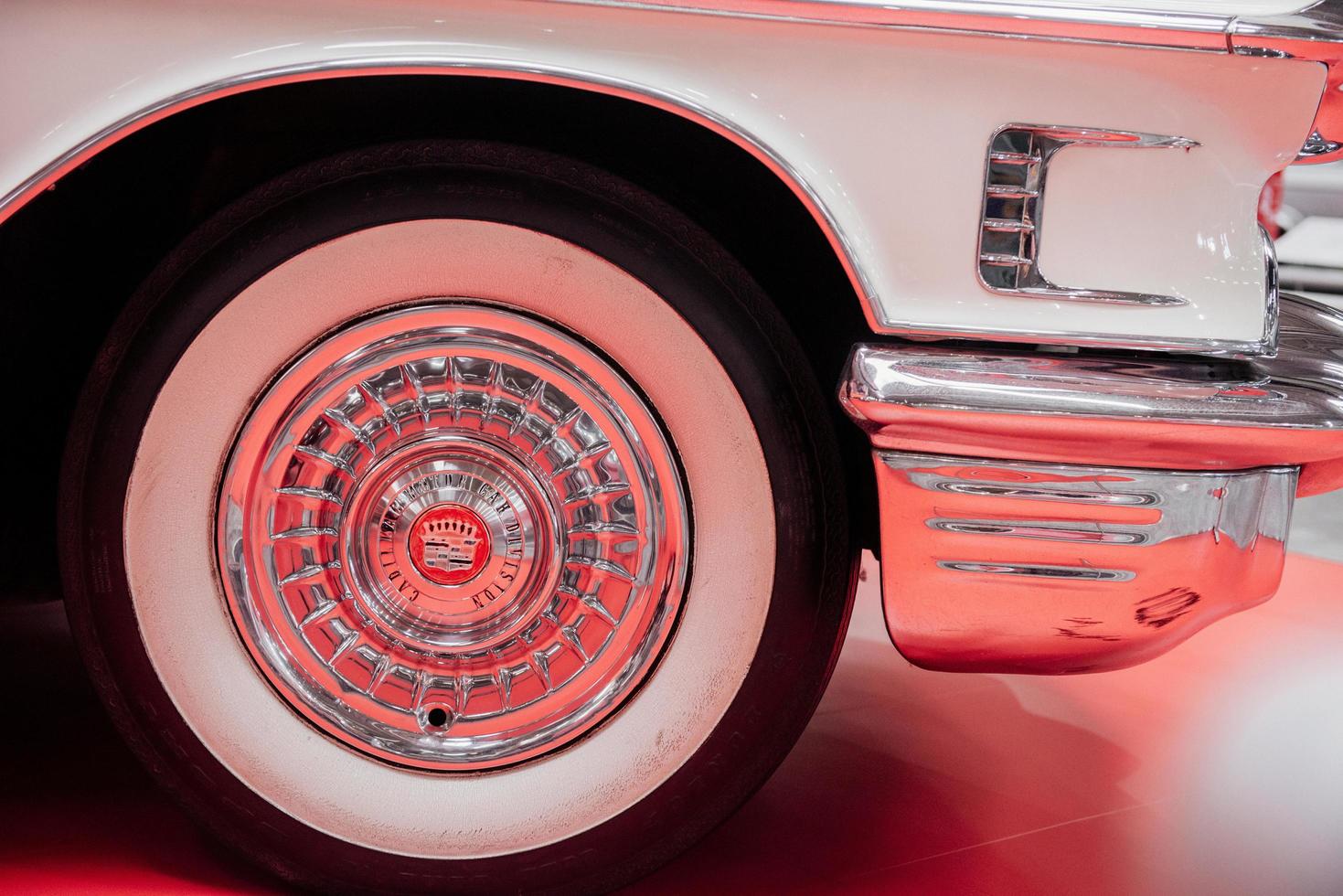 SINSHEIM, GERMANY - OCTOBER 16, 2018 Technik Museum. Close up photo of wheel of the white retro car