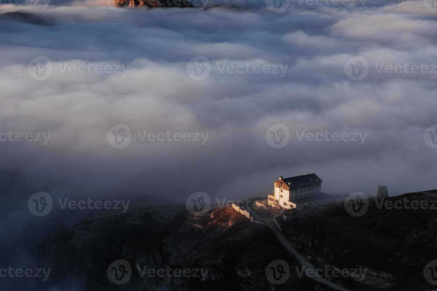 Not sure if this position is safe but it's gorgeous. Morning sunlight is going to disperse the fog in this beautiful mountain place photo