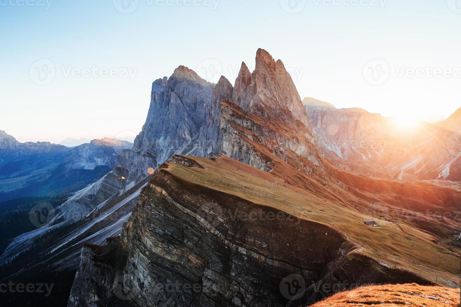 Variety of blue and yellow colors. Beautiful sunset in the Italian majestic Seceda dolomite mountains photo