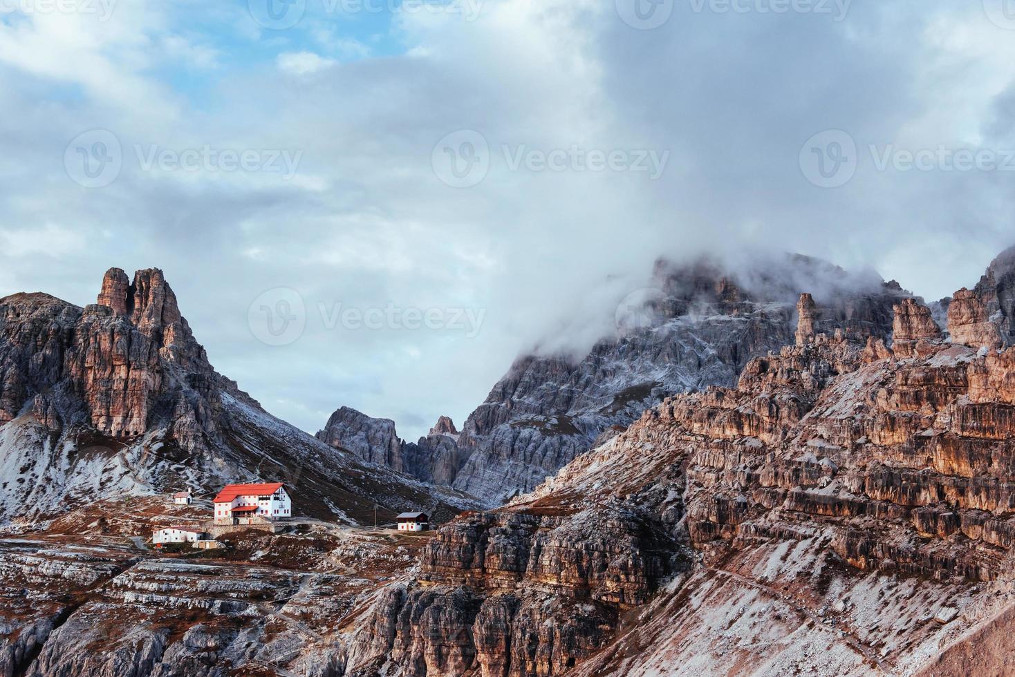 An extraordinary spectacle. Touristic buildings waiting for the people who wants goes through these amazing dolomite mountains photo