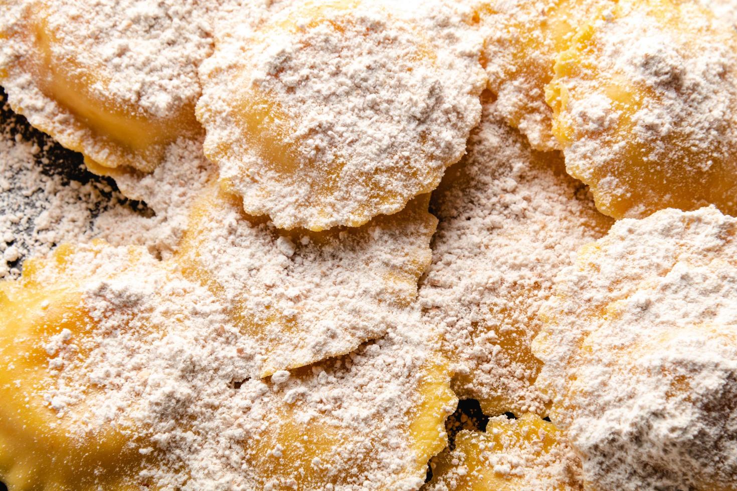 Cooking italian ravioli on wooden table. Top View with Copy Space. photo