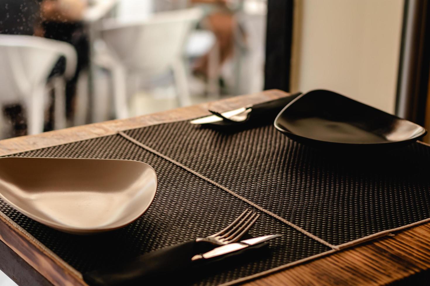 table prepared for customers in restaurant photo