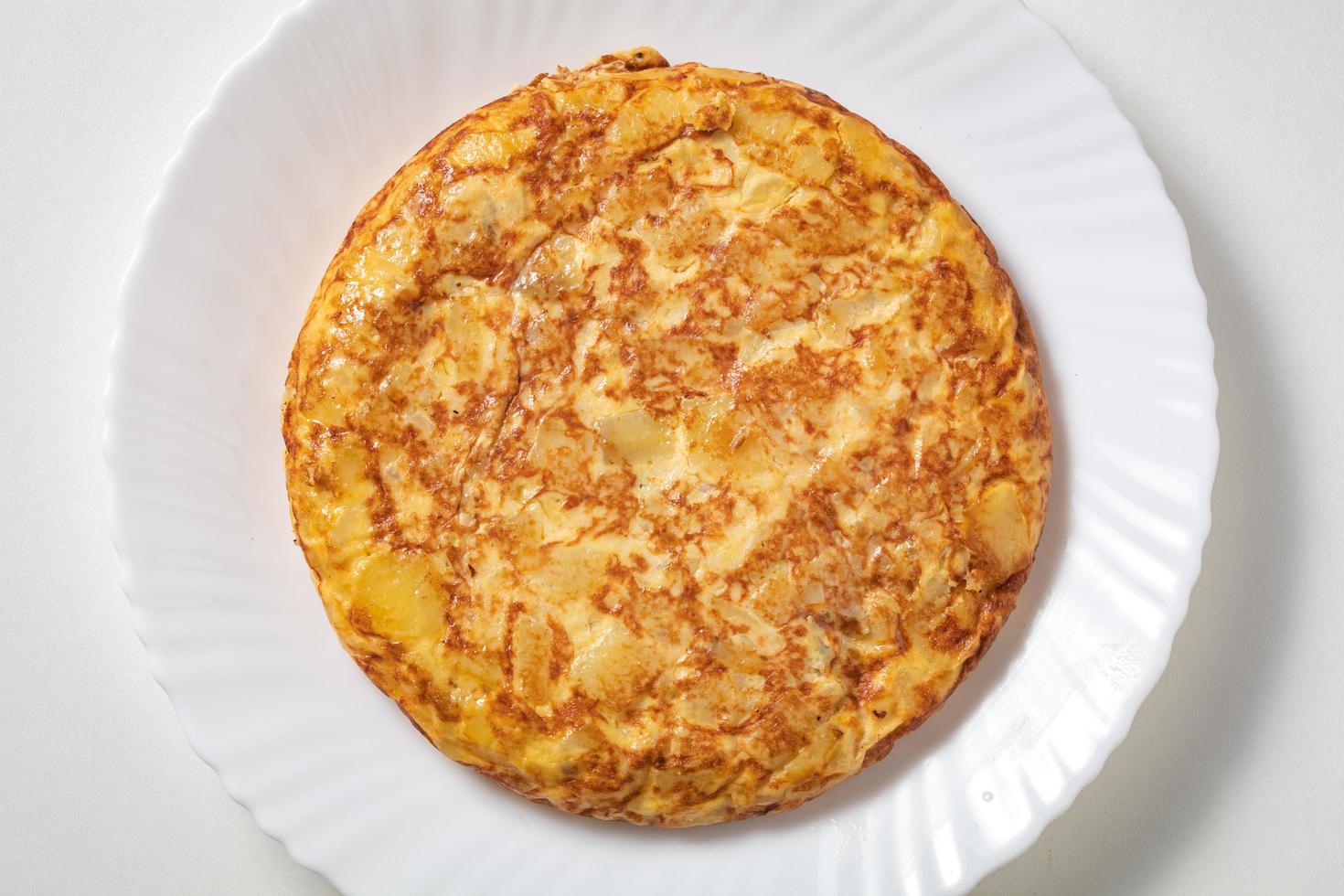 Spanish omelette on white plate photo