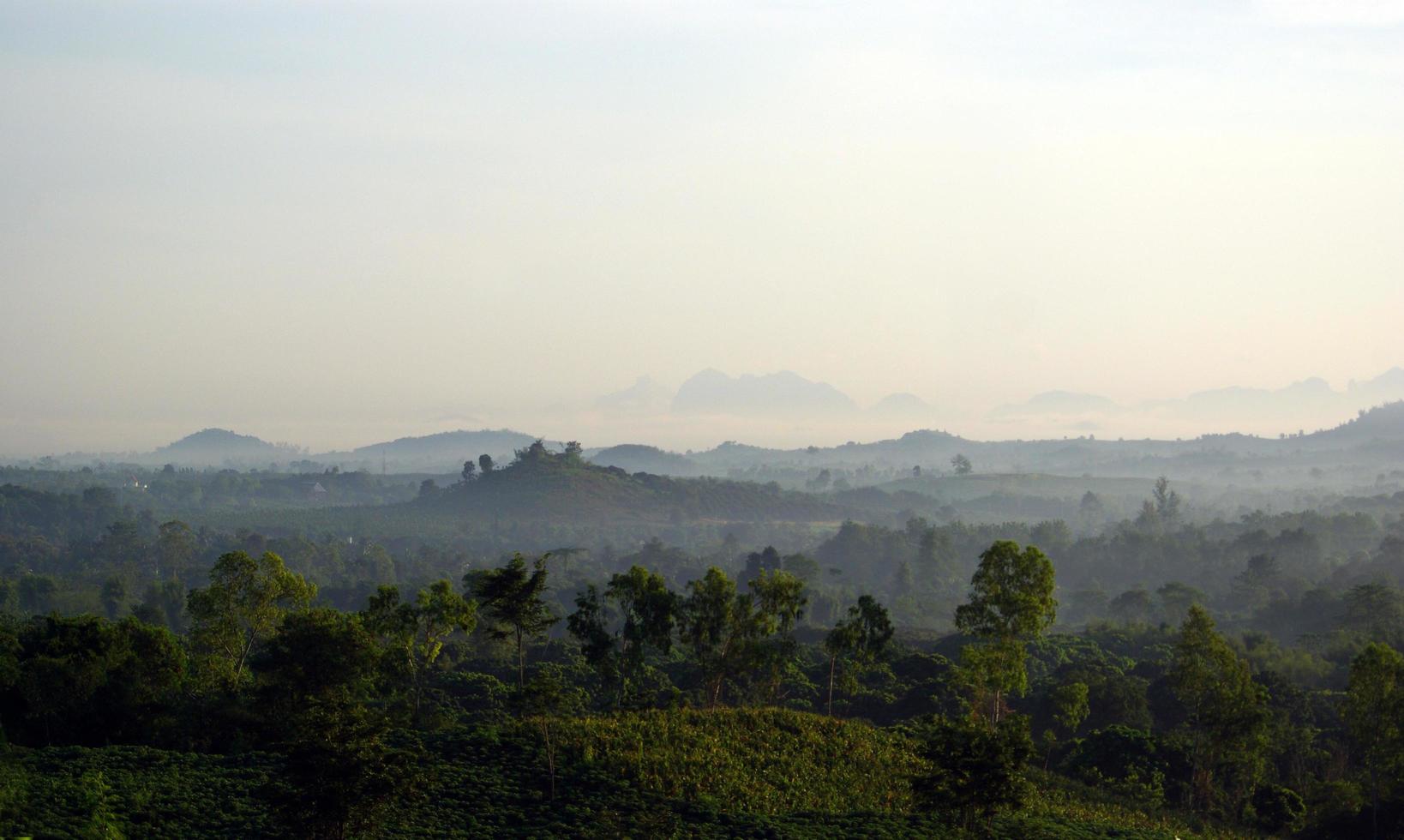 Morning mist and mountain view in the countryside photo