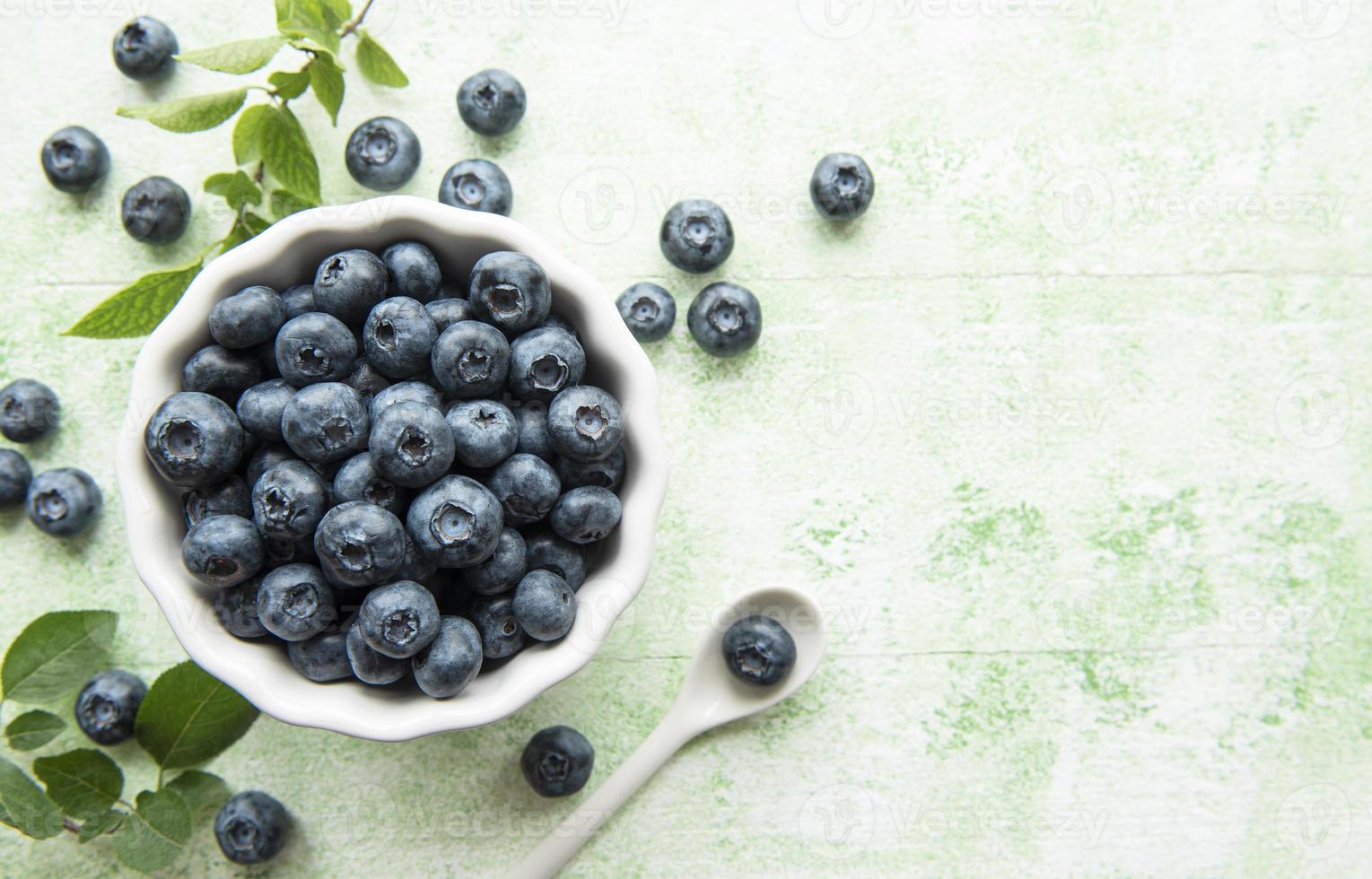 Blueberries on wooden background photo