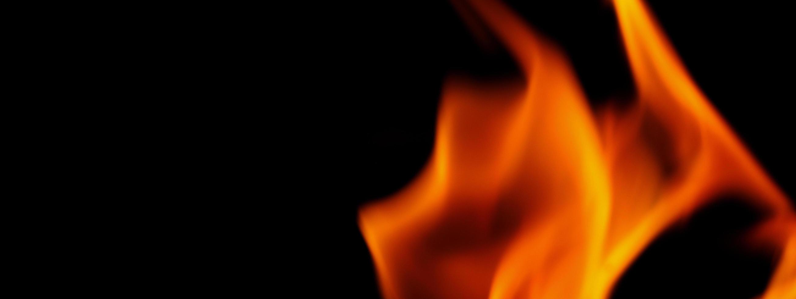 Fire background. Abstract burning flame and black background. photo