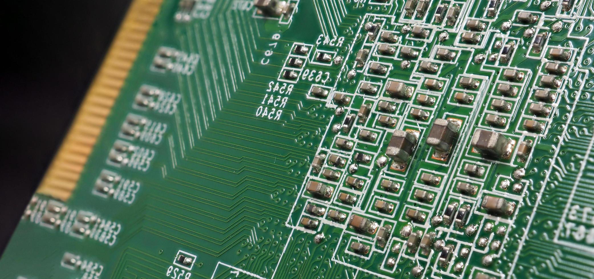 Semiconductor. cpu chip located on the green motherboard of the computer. photo