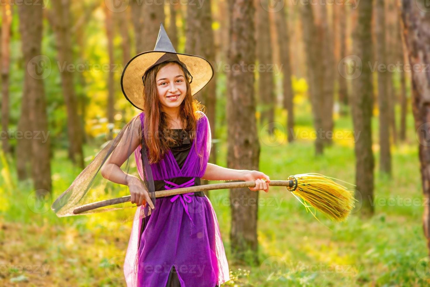 Girl 11 years old against the background of autumn nature. Little girl in Halloween costume, autumn. photo