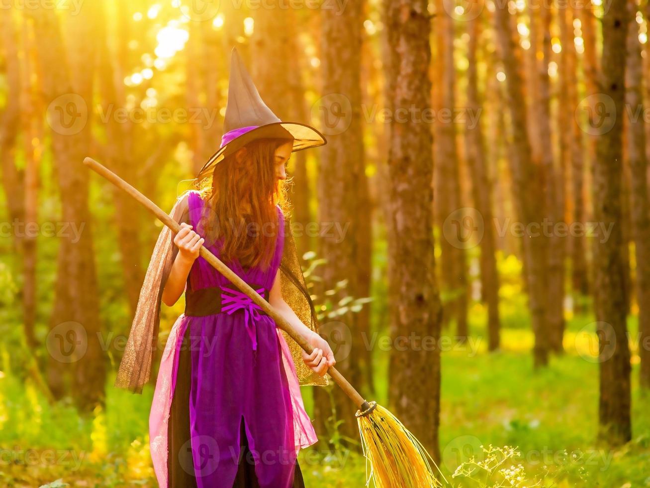 Girl 11 years old against the background of autumn nature. Little girl in Halloween costume, autumn. photo